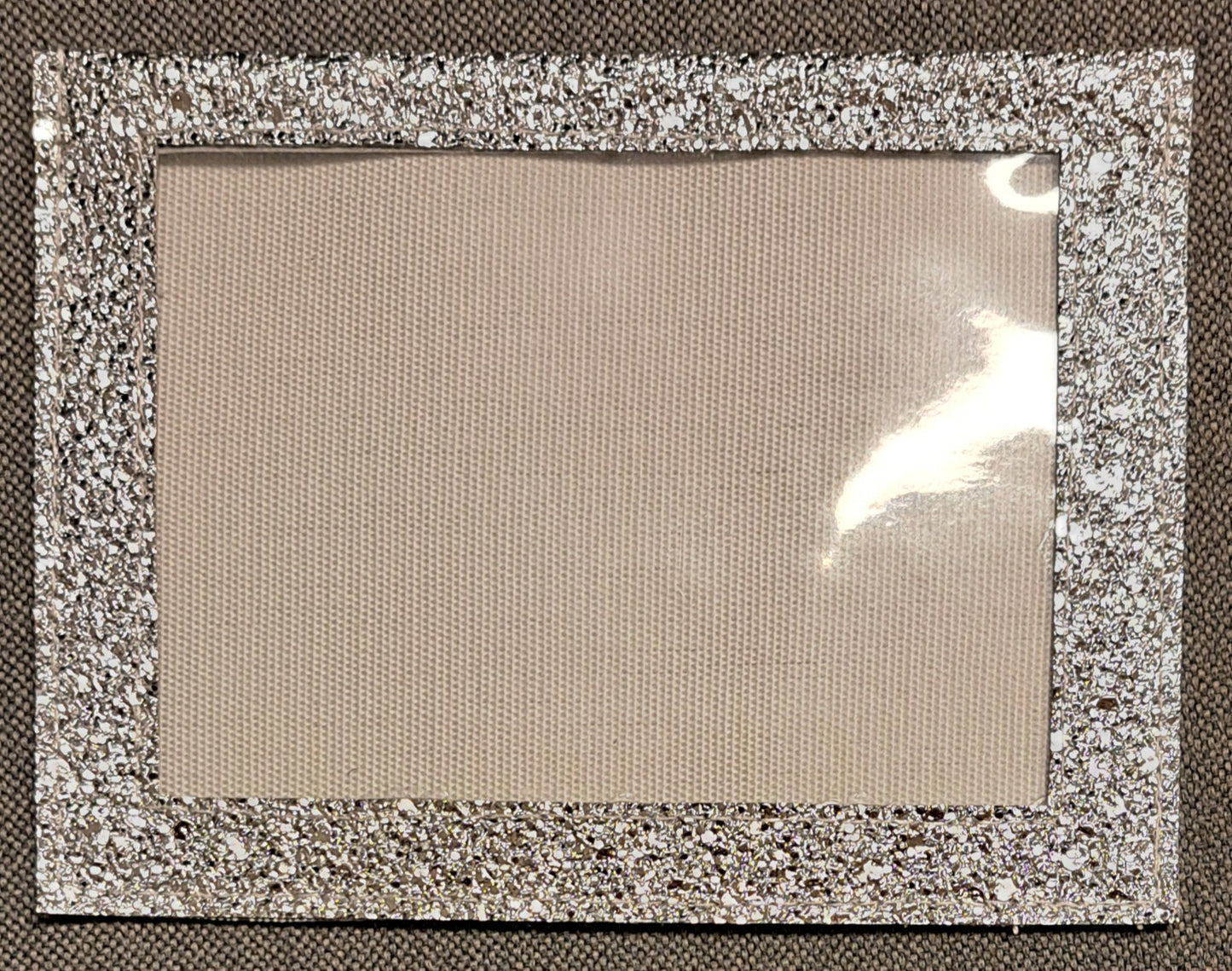 Glittrig kardborreficka utan armband